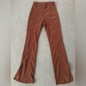 Kirious brown corduroy ribbed flare pants with slits at bottom, size XS